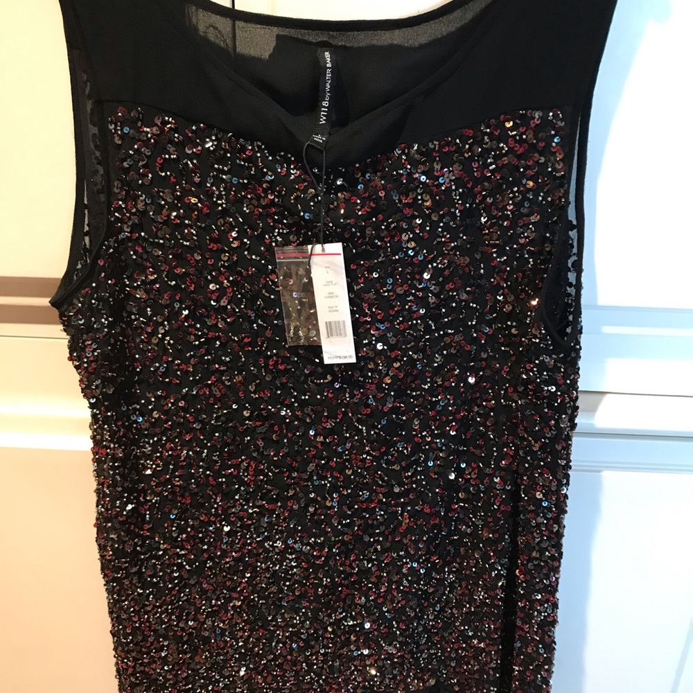 Stunning silk like fully sequenced evening top.
